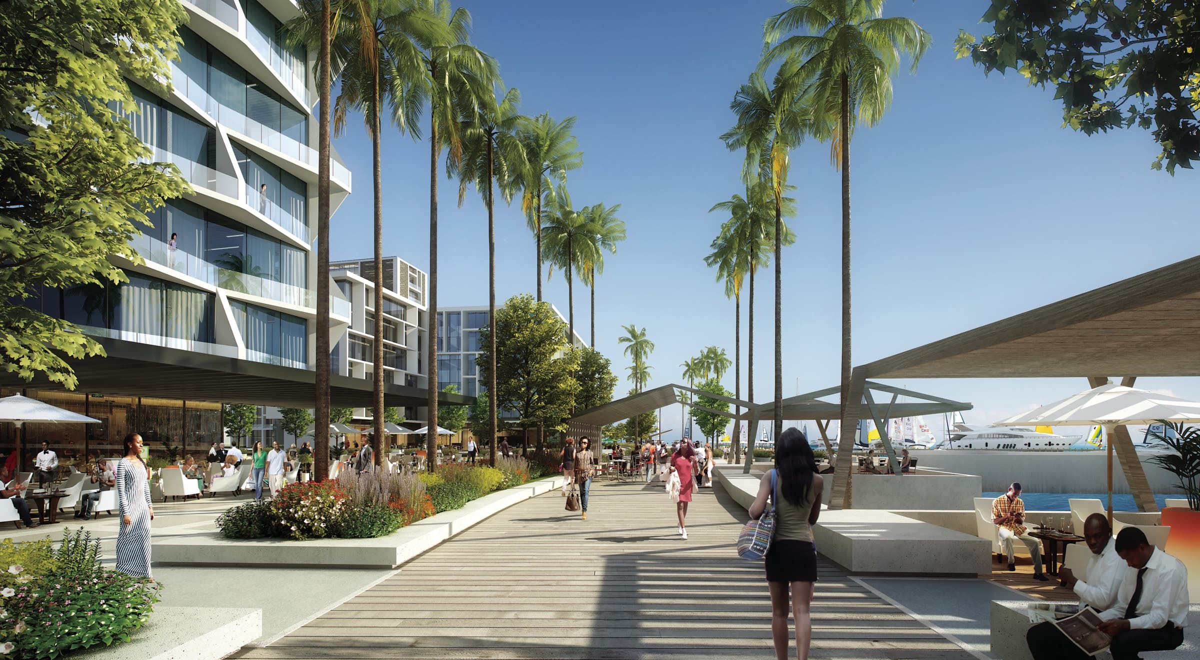 The waterfront by the marina: palms, shade canopies and café tables, people walking, yachts moored beyond
